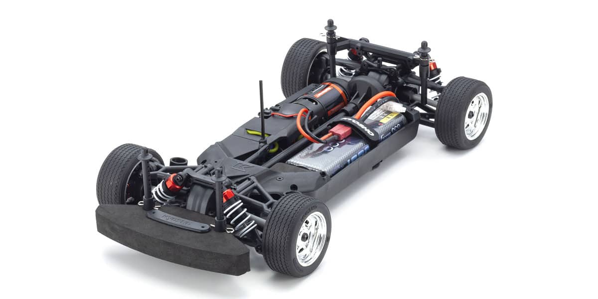 Kyosho official FZ02L body-off layout from the El Camino page; chassis technical context without substituting a black sibling body for the silver T2.