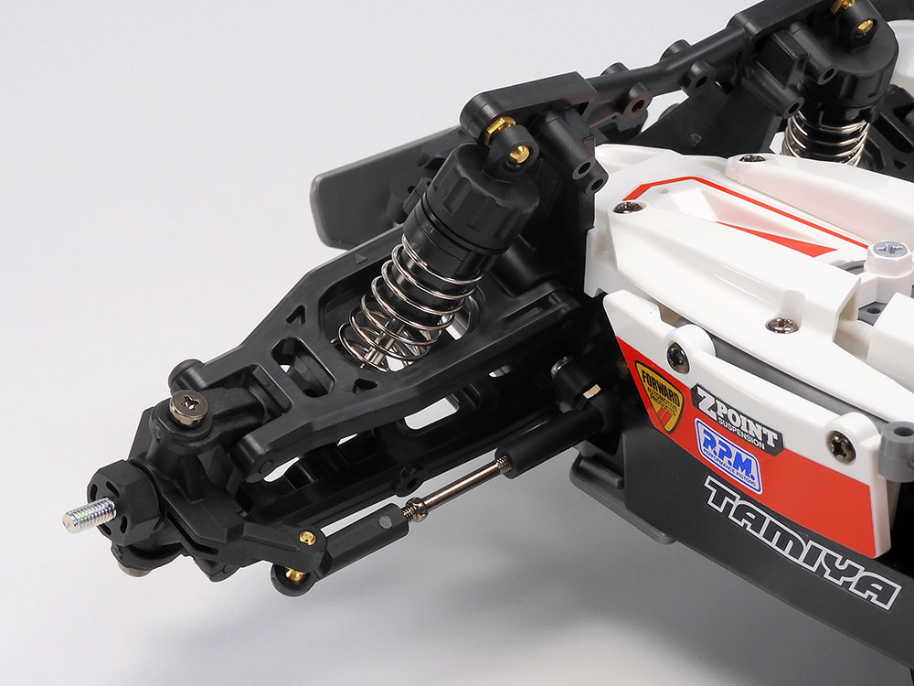 Tamiya official front-end detail: long arms, turnbuckle steering link and CVA oil damper.